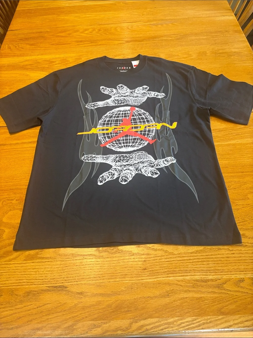 Jordan Black Short-Sleeve Graphic Tee with Red and Yellow Logo